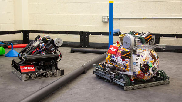 Two VEX robots on a VEX robotics field